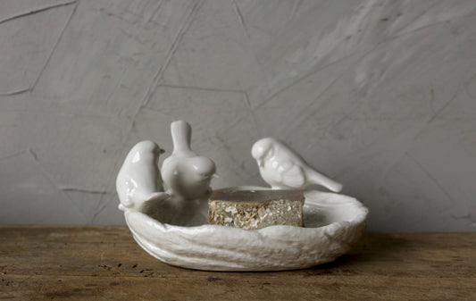 White ceramic leaf-shaped dish with three bird figures; holds soap or trinkets. Available in small, medium, and large sizes.