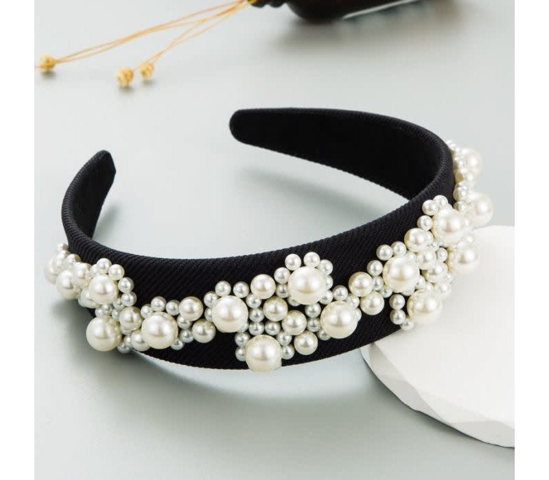 Black fabric headband with small and large white faux pearls. Available sizes: S, M, L.