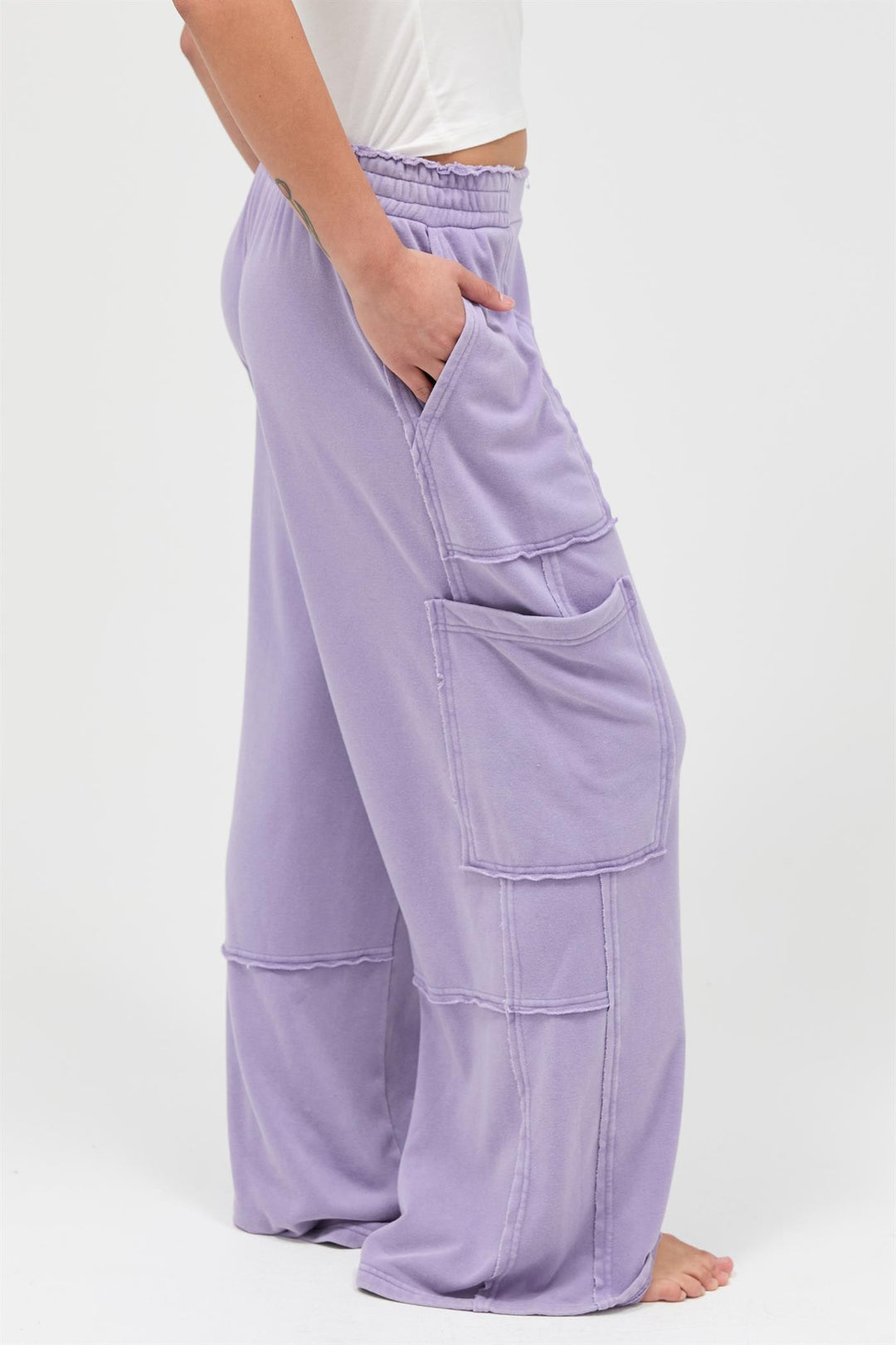 Mineral Wash Wide Leg Cargo Pants in light purple with high-rise, wide legs, large patch pockets. Sizes: XS-XL.