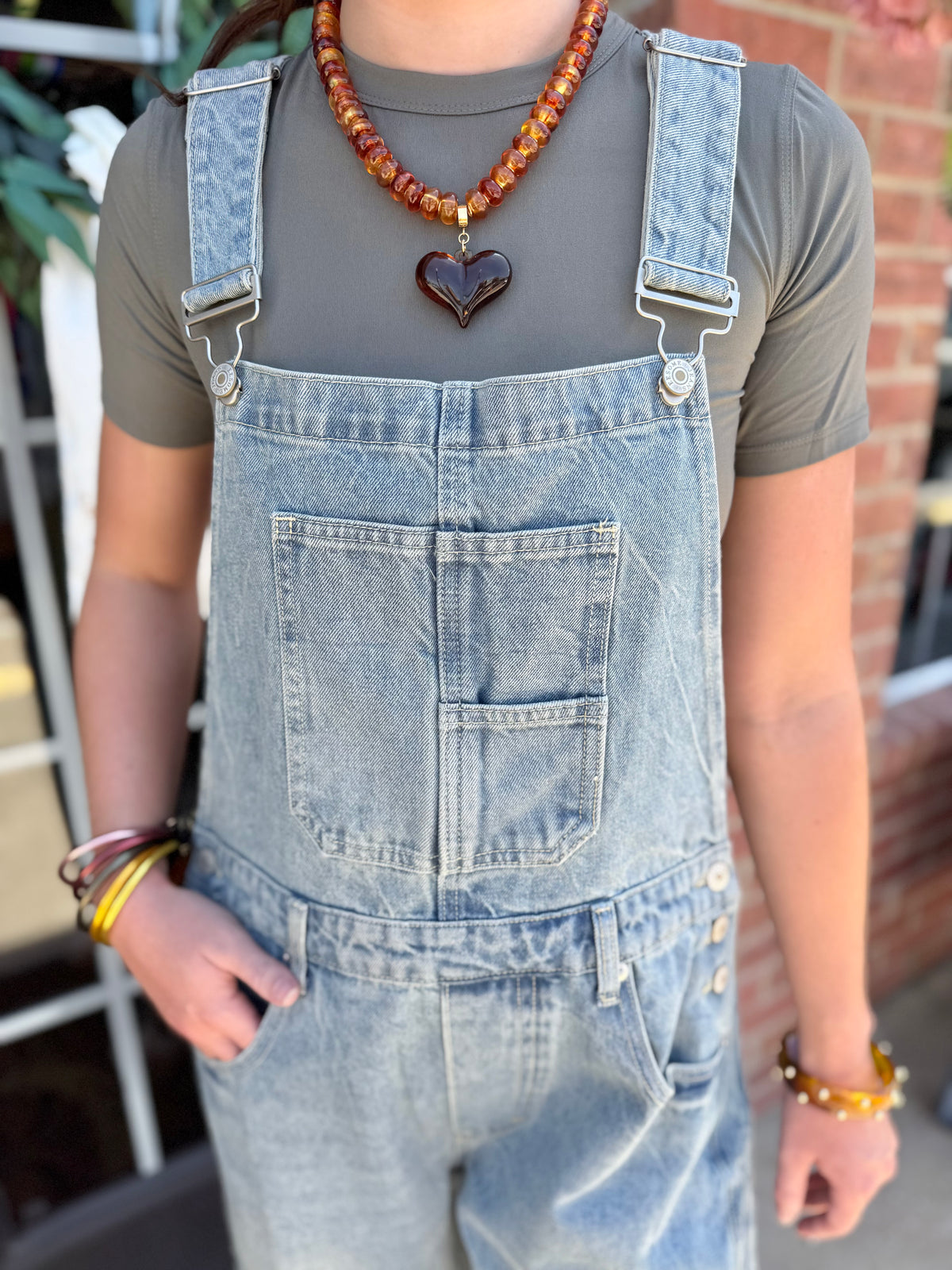 Dakota Mineral Wash Denim Jumpsuit in a relaxed fit and mineral wash finish, available in sizes XS-XL.