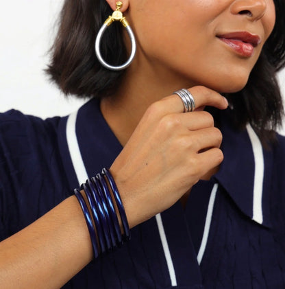 Shiny, waterproof Midnight All Weather Bangles handcrafted in Thailand, available in small, medium, and large sizes.