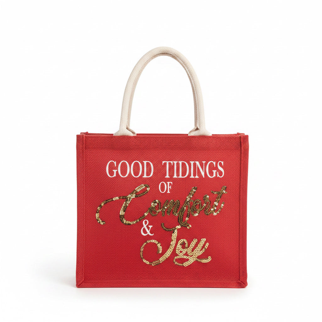 Comfort &amp; Joy Sequin Gift Tote: a red holiday tote with rope handles and “GOOD TIDINGS OF Comfort &amp; Joy” in white and gold sequins.