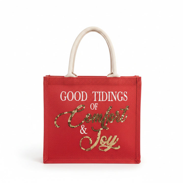Comfort &amp; Joy Sequin Gift Tote: a red holiday tote with rope handles and “GOOD TIDINGS OF Comfort &amp; Joy” in white and gold sequins.