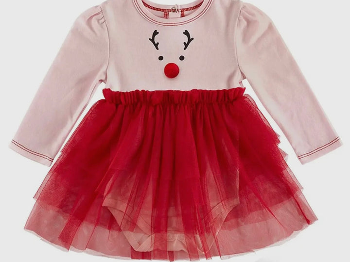 Light pink Tutu Reindeer Dress with reindeer face graphic, red pom-pom nose, and layered red tulle skirt. Available in sizes for first Christmas.