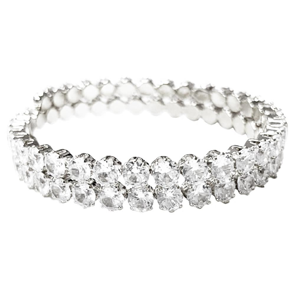 Memory wire cuff bracelet with two rows of clear round cubic zirconia stones; available in small, medium, and large sizes.