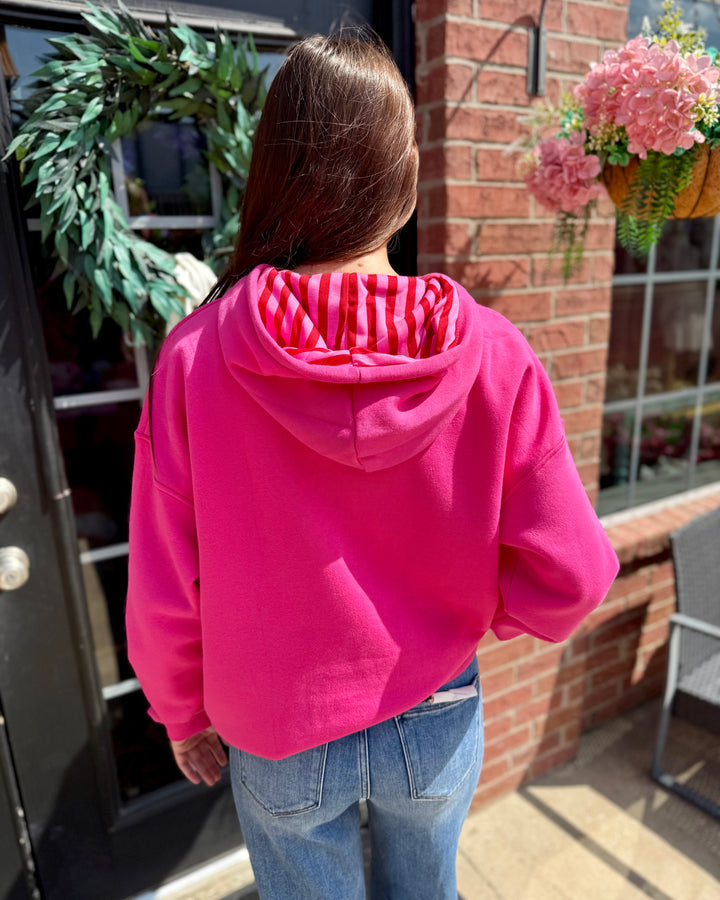 Striped Scallop Merry Hoodie with a red and white striped hood, available in sizes XS-XXL.