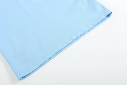 Blue Puppy Polo Golf Shirt, close-up of bottom hem with visible stitching and texture. Available in sizes S, M, L, XL.