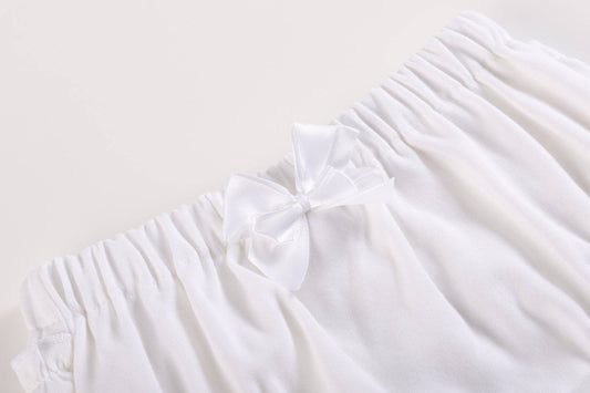 White and pink baby bloomers waistband with soft cotton, elastic band, white ruffles, satin bow. Available in size 3-6M.