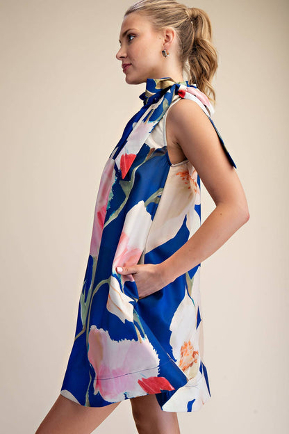 Mini Dress Ruffle Neck Tie Sleeveless Floral Print in Royal. Available in sizes S, M, L, XL.