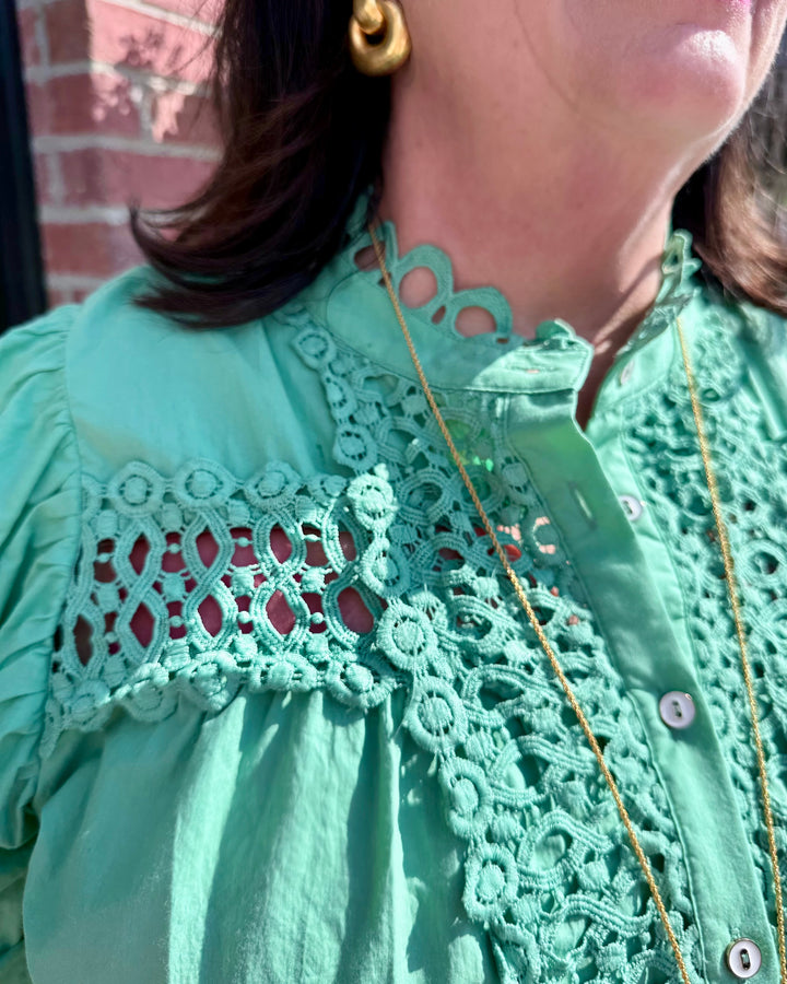 Mint Button Down Blouse with lace shoulder details and balloon sleeves. Available in sizes XS–XL.