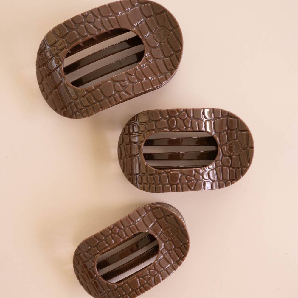 Three brown crocodile small flat round hair clips, oval-shaped with a textured crocodile pattern, available in small size.