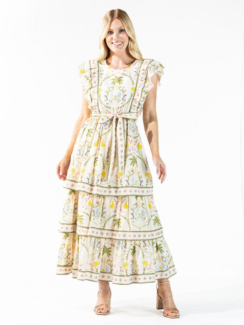 Cabana Tiered Dress: cream 100% cotton maxi with tropical print, tiered skirt, matching belt. Sizes XS-XL.