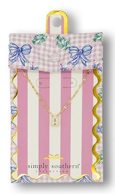 Gold bow-shaped initial pendant necklace, available in small size, in a Simply Southern pink-striped floral gift box.