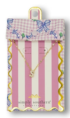 Gold cursive "J" pendant necklace with cubic zirconia. Available in small size.