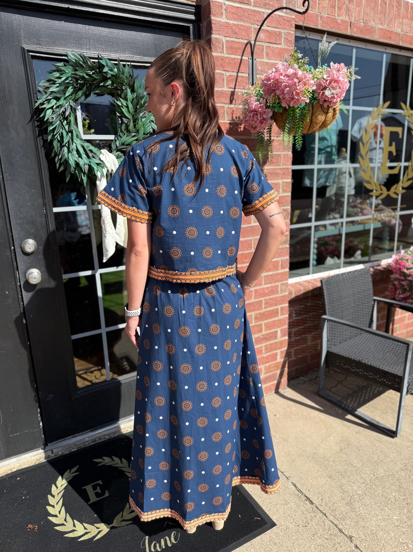 Auburn Medallion Skirt Set featuring a patterned top and matching skirt; available in sizes XS to XL.