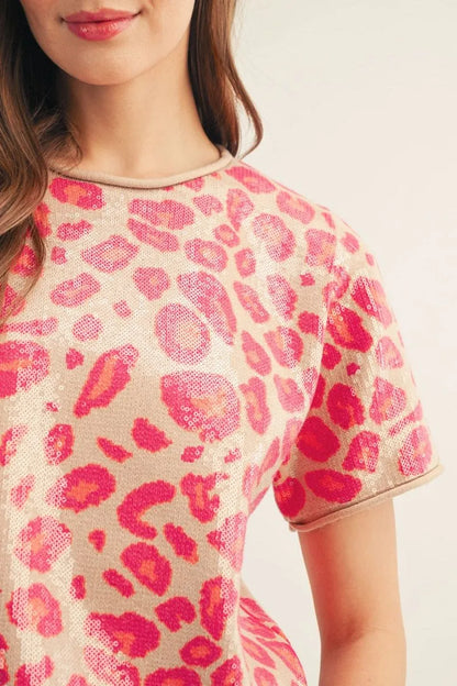 Pink Sequin Covered Leopard Top with a beige base and bright pink sequin leopard spots; available in sizes XS-XL.