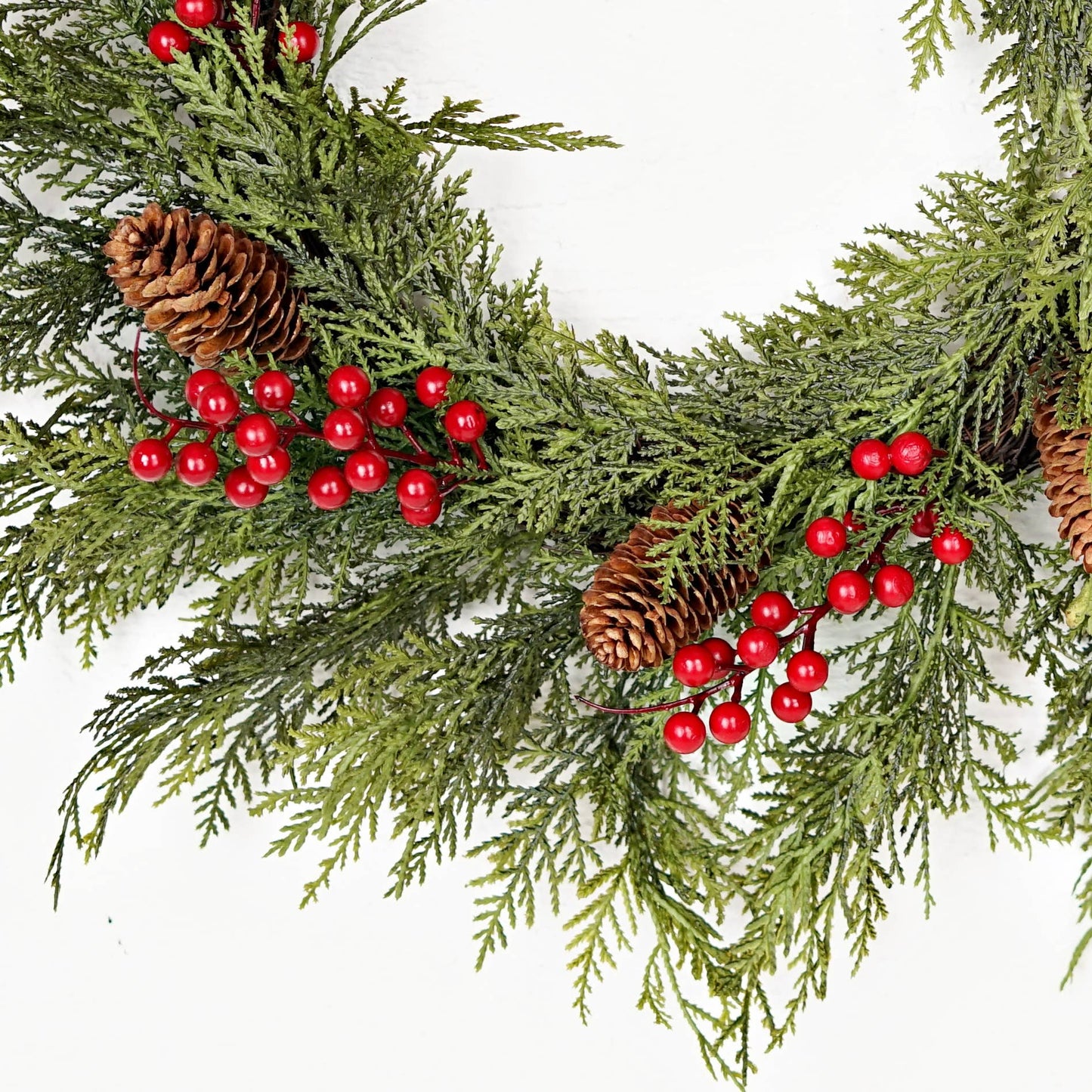 510050 - 22in Twig Wreath with real touch cedar, green pine branches, red berries, and brown pinecones; available in 22 inches.