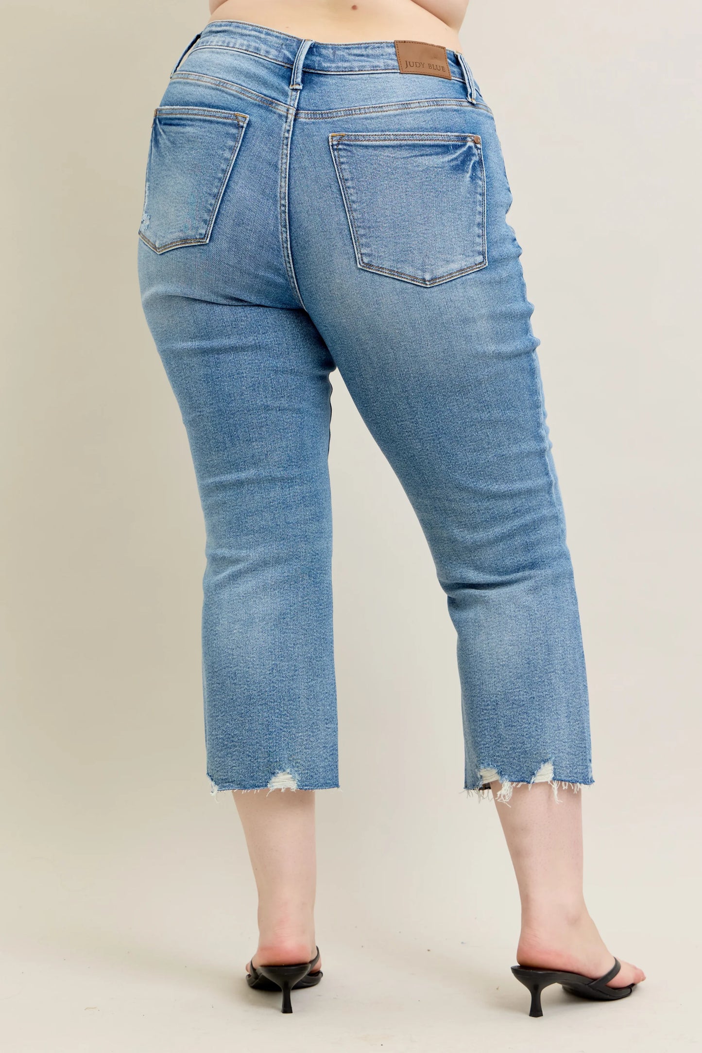 Judy Blue MR Vintage Wash Destroy Hem Kick Flare Jeans in light blue, frayed hems. Available in sizes 0-20.