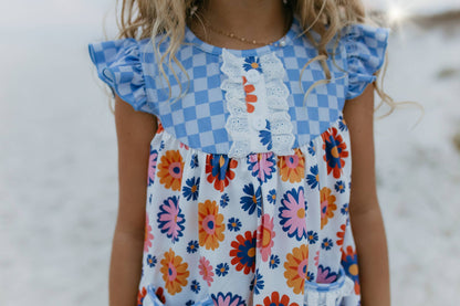 Girls Blue Check Flower Power Short Set with ruffled sleeves and retro floral shorts. Available in sizes 2T-8.
