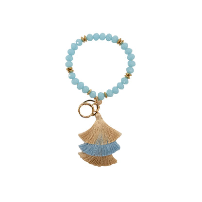 Light blue beaded bangle keychain with gold accents, beige-blue tassel, and key ring. Available in small, medium, large.