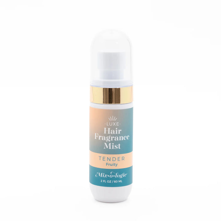 Mix O Logie Hair Fragrance Mist | Tender, alcohol-free, 2 fl oz (60 mL), fruity scent in gold-accented blue-peach gradient bottle.