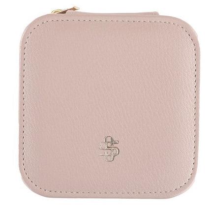 Simply Southern Leather Jewelry Case: Small, square, blush PU leather pouch with rounded corners and top zipper. Features subtle embossed logo at center front. Ideal for storing jewelry during travels. Available size: Small.