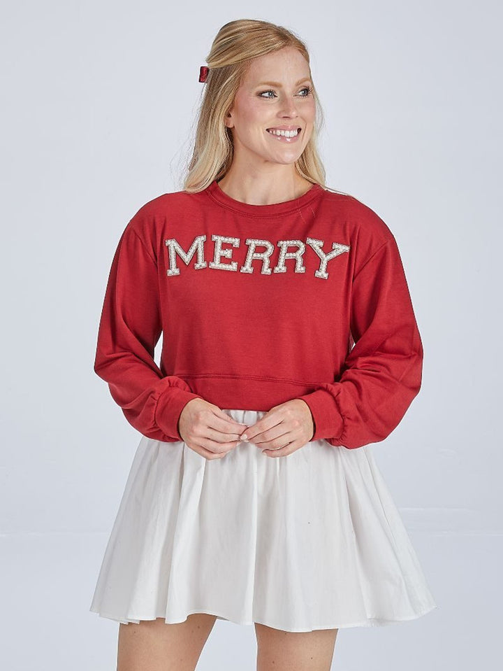 Twyla Red Merry Dress, a red Simply Southern long-sleeve sweatshirt with white “MERRY” lettering and a white skirt. Sizes available.