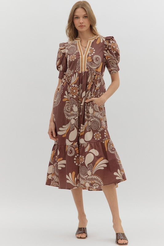 Betty Floral Dress: brown midi, cream/yellow florals, puff sleeves, gathered waist, pockets. Sizes XS-XL.