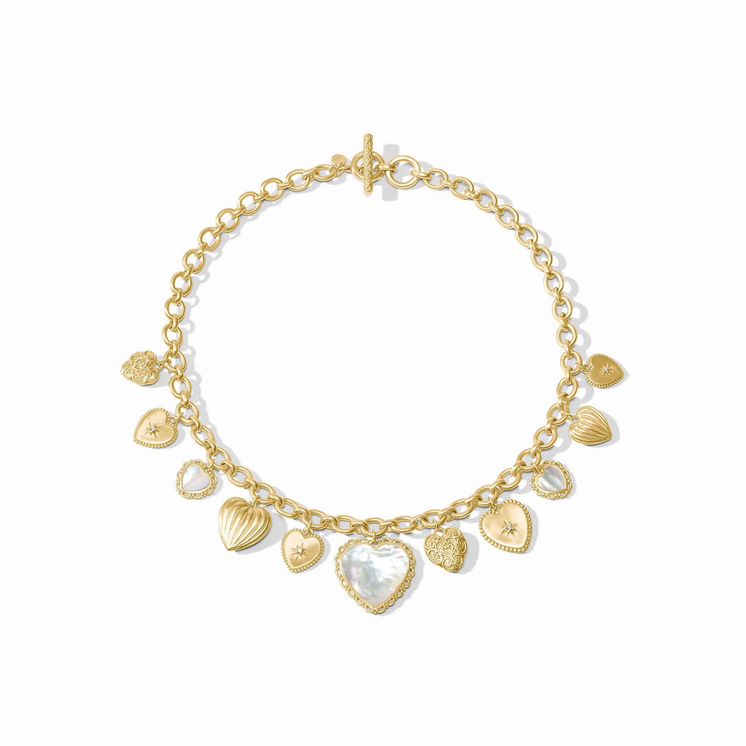 Gold chain necklace with textured gold and white mother of pearl heart charms, toggle clasp. Available in 16" and 18" lengths.