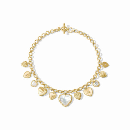 Gold chain necklace with textured gold and white mother of pearl heart charms, toggle clasp. Available in 16" and 18" lengths.