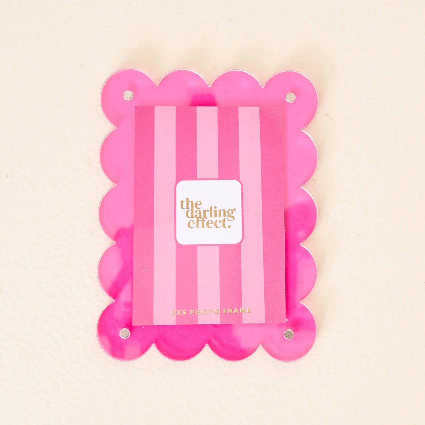Mini acrylic frame magnet in hot pink with scallop edges, gold text, and four corner holes. Size: mini.