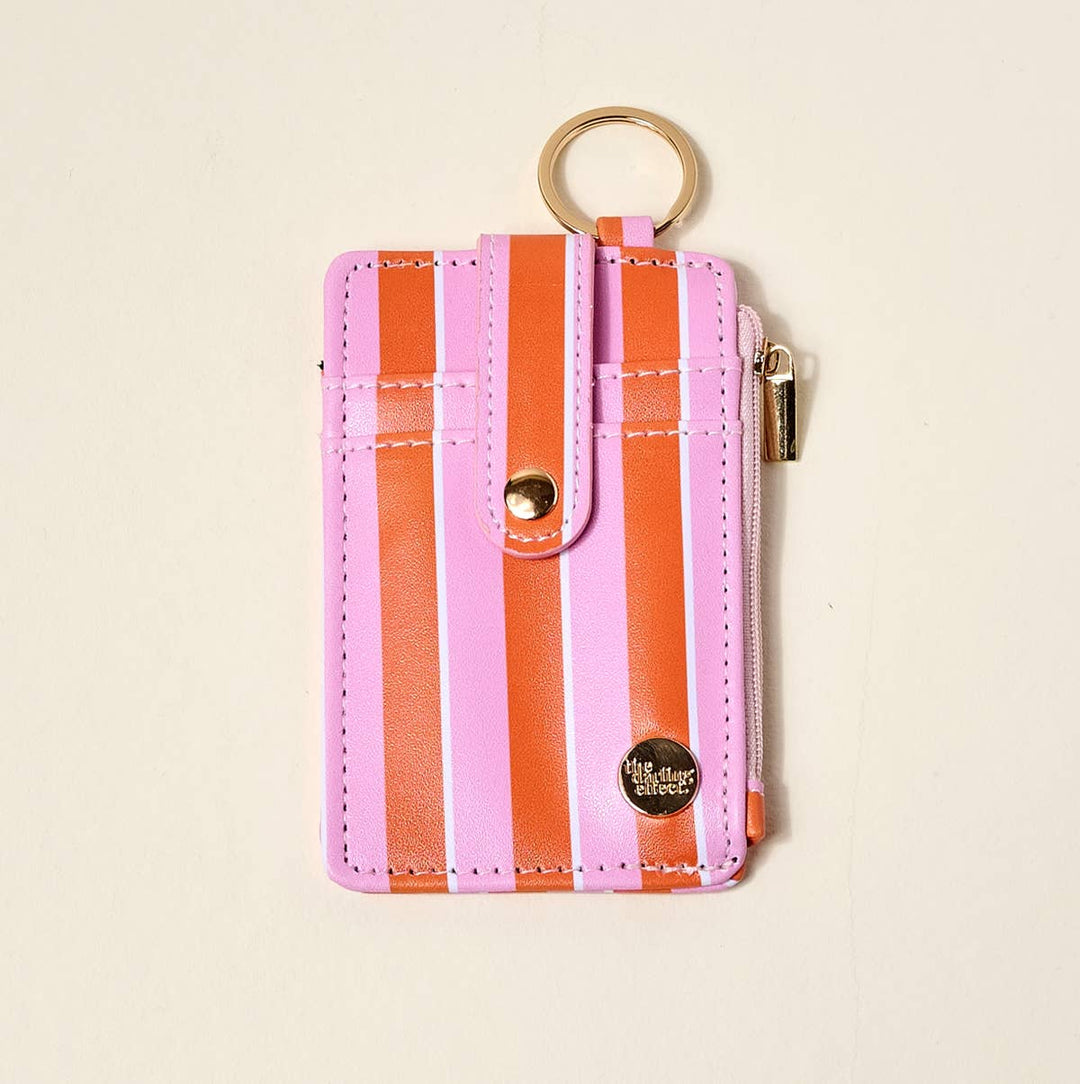 Keychain Wallet–Sicily Stripes Pink: slim pink/orange stripes, gold keyring, snap strap, side zipper. Sizes: S, M.