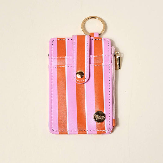 Keychain Wallet–Sicily Stripes Pink: slim pink/orange stripes, gold keyring, snap strap, side zipper. Sizes: S, M.