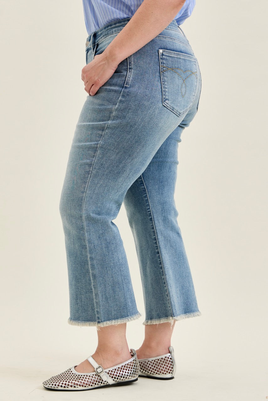 Judy Blue MR Kick Flare Jeans with frayed hem; available in sizes 0-20.