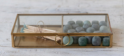 Brass and glass display box with ring handle, available in small and large sizes.