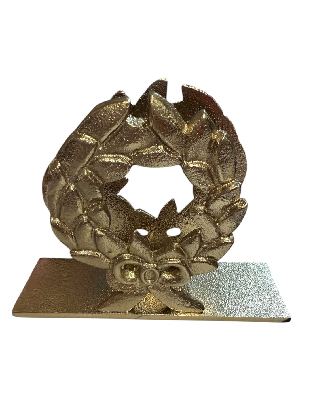 Gold-tone metal laurel wreath napkin holder with a decorative bow.