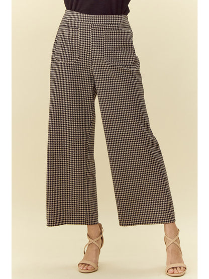 Houndstooth Check Wide Leg Pants featuring a high-rise waistline, wide flared legs, black and white houndstooth pattern, two front pockets. Sizes: XS, S, M, L.