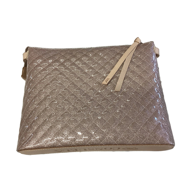 Shimmering rosegold quilted Downtown Crossbody, Ori, with adjustable strap and zipper pull. Available in various sizes.