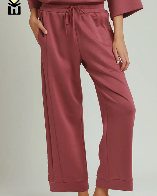Loose-fitting, marsala-colored Butterfly Lace Straight Leg Pants. Available in sizes XS–XL.
