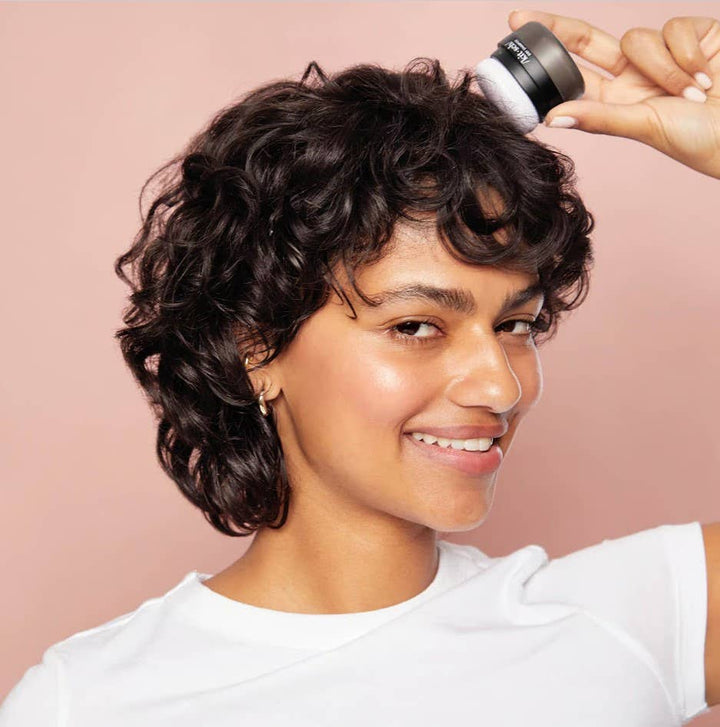 Volumizing Rice Protein Dry Shampoo - Dark Tinted Powder applied with round brush. Available in 1oz and 2oz sizes.