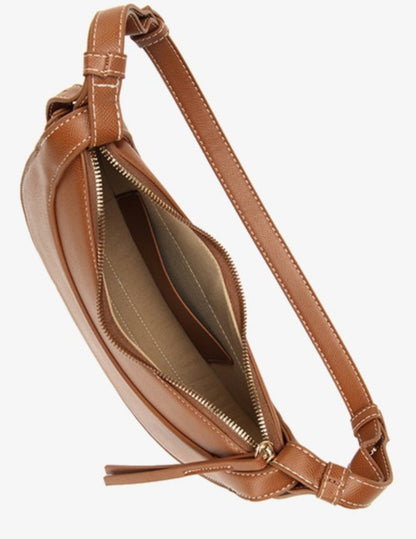 Brown Alice Crescent Crossbody purse in vegan leather, adjustable strap, white stitching, beige-lined interior, small pocket. Sizes: S/M/L.