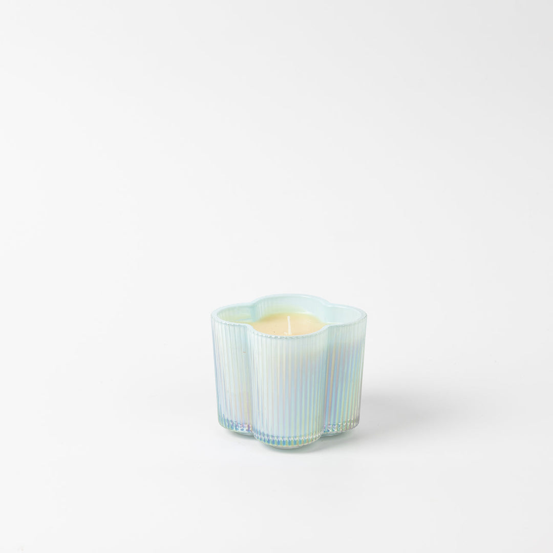 Sweet Grace Collection Flower Candle 7.2 oz, light yellow in an iridescent, wavy, flower-shaped glass holder.