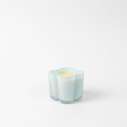 Sweet Grace Collection Flower Candle 7.2 oz, light yellow in an iridescent, wavy, flower-shaped glass holder.