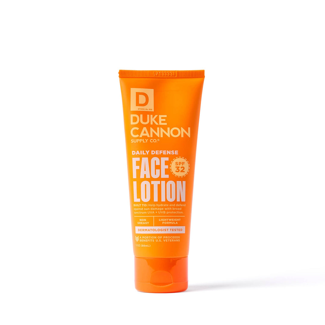 The Duke Cannon Daily Defense Face Lotion in bright orange tube, SPF 32, lightweight, dermatologist tested; available in 3.4 oz.