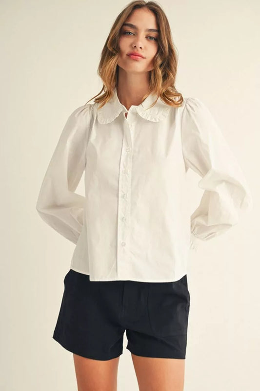 Off-White Ruffle Collar Button-Up Blouse with ruffled collar, button front; available in sizes XS–XL.