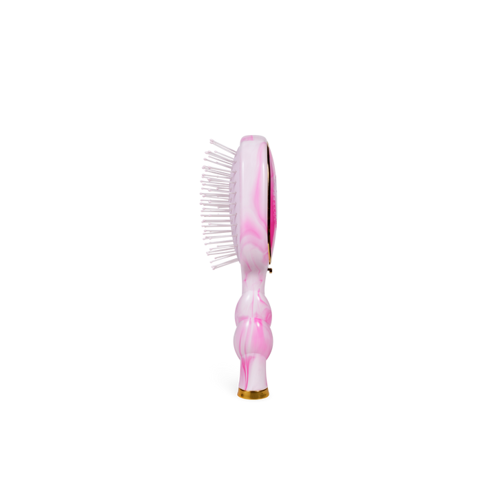 Mini Detangler Brush | Medium | Pinch Me! in pink with a marbled pattern and visible bristles. Available in medium size.