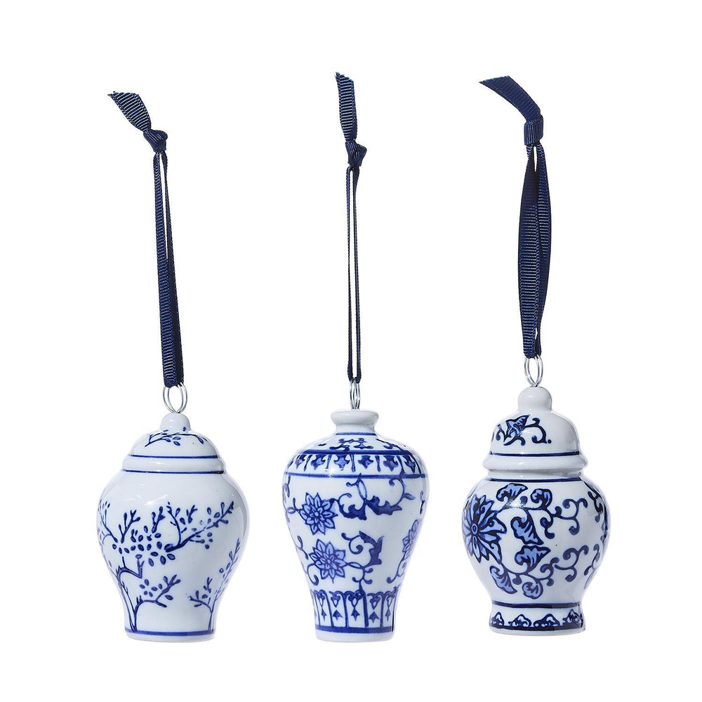 Three blue and white Ginger Jar ornament place card holders with navy ribbon hangers.