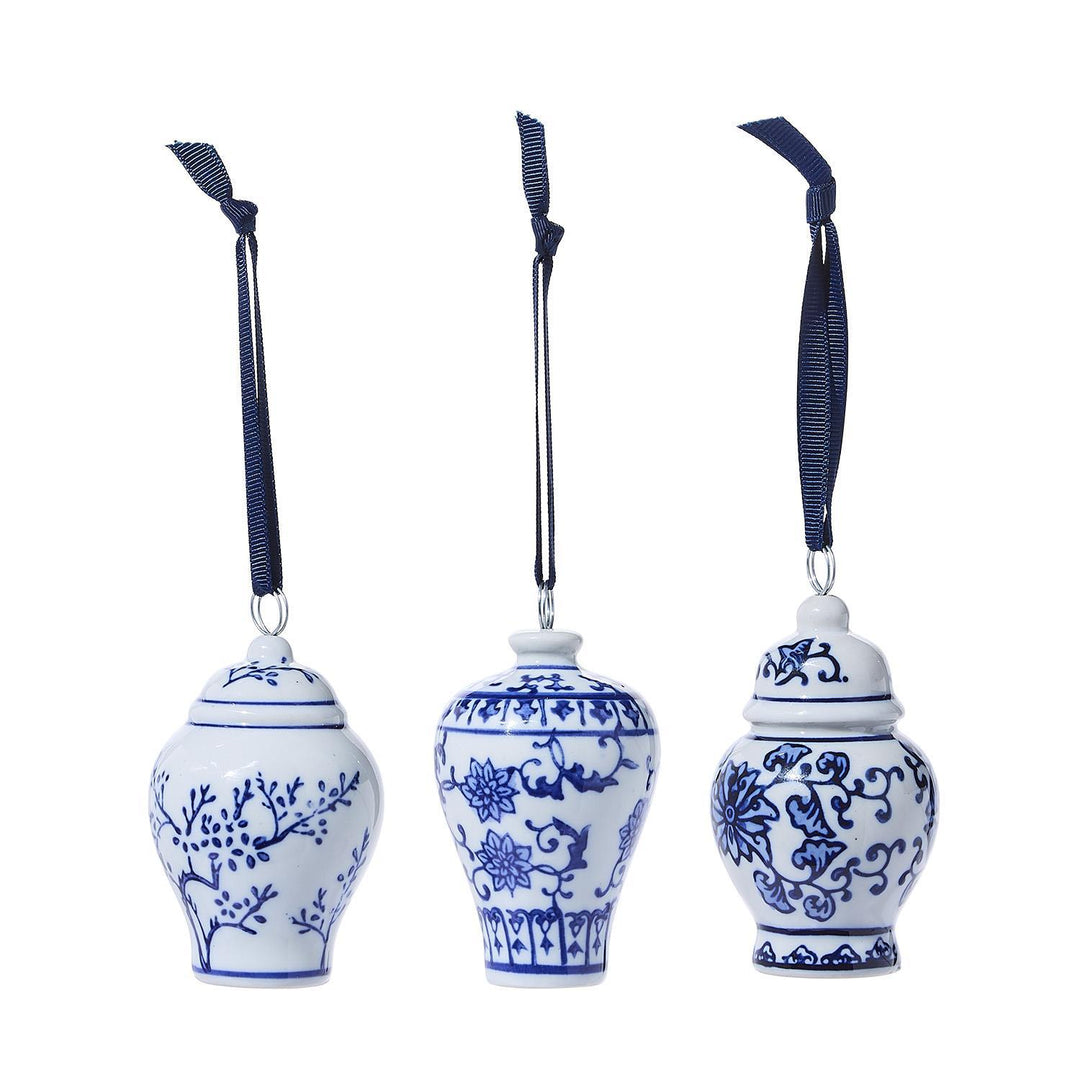 Three blue and white Ginger Jar ornament place card holders with navy ribbon hangers.