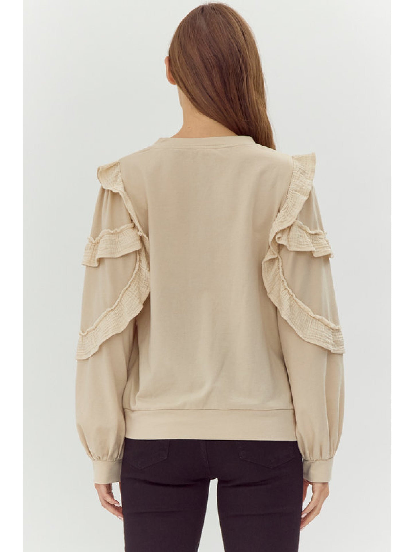 Sweatshirt Top with Ruffles & Ribbed Hems in beige. Intricate ruffled details on shoulders and upper arms. Sizes available: S, M, L, XL.