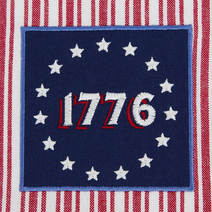 Betsy Ross Dishtowel: blue square with “1776,” 13 white stars, red/white stripes. Sizes available: standard kitchen towel.